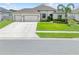 Charming single-story home with a well-manicured lawn and a spacious three-car garage at 1789 Chatsworth Cir, St Cloud, FL 34771