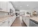 Bright kitchen with white cabinets, stainless steel appliances, granite countertops, and wood floors at 1789 Chatsworth Cir, St Cloud, FL 34771