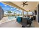 Relaxing lanai features a screened pool, outdoor seating, and view to backyard landscaping at 1789 Chatsworth Cir, St Cloud, FL 34771
