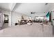 Spacious living room with ceiling fan, comfortable seating, and seamless flow to the kitchen at 1789 Chatsworth Cir, St Cloud, FL 34771