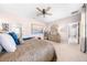 Comfortable main bedroom with a ceiling fan, and views of the ensuite bathroom at 1789 Chatsworth Cir, St Cloud, FL 34771