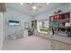 Well-lit home office with built-in shelves, desk space, and a window seat offering additional storage at 1789 Chatsworth Cir, St Cloud, FL 34771
