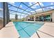 Spacious screened-in pool area with a covered patio, ideal for outdoor entertainment and relaxation at 1789 Chatsworth Cir, St Cloud, FL 34771