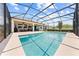 Large screened-in pool and lanai, complemented by a well-maintained backyard and inviting outdoor space at 1789 Chatsworth Cir, St Cloud, FL 34771