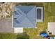 Aerial view of a home featuring a screened-in pool, large backyard and ample parking at 18826 Reynolds Pkwy, Orlando, FL 32833