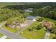 An aerial view showcases a home with a sprawling lawn, mature trees, and lush landscaping at 18826 Reynolds Pkwy, Orlando, FL 32833