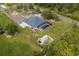 Aerial view of a well-maintained property with a screened-in pool and detached structure at 18826 Reynolds Pkwy, Orlando, FL 32833