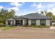 Charming single-story home boasting a manicured lawn, contrasting trim, and an inviting front entrance at 18826 Reynolds Pkwy, Orlando, FL 32833