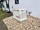 Generac generator outside a home with a rock surround at 18826 Reynolds Pkwy, Orlando, FL 32833
