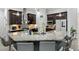Modern kitchen boasting a granite island, stainless steel appliances, and dark wood cabinetry at 18826 Reynolds Pkwy, Orlando, FL 32833