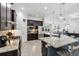 Stylish kitchen with a large granite island, dark wood cabinets, and stainless steel appliances at 18826 Reynolds Pkwy, Orlando, FL 32833