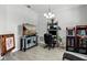 Comfortable office space with an oversized TV, gaming consoles, and a computer desk at 18826 Reynolds Pkwy, Orlando, FL 32833