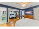 Bedroom with blue walls with mirrors for multiple views at 1924 Summerfield Rd, Winter Park, FL 32792