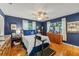 Bedroom with blue walls, wooden floor and dressers at 1924 Summerfield Rd, Winter Park, FL 32792