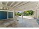 View of the covered carport showing the storage area and driveway to the main street at 1924 Summerfield Rd, Winter Park, FL 32792