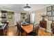 Dining room with wooden floor and light tan walls at 1924 Summerfield Rd, Winter Park, FL 32792