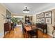 Classic dining room featuring hardwood floors, tan walls, and decorative vintage accents at 1924 Summerfield Rd, Winter Park, FL 32792