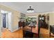 Traditional dining room featuring a wood table, parquet floors, and view into the adjacent living room at 1924 Summerfield Rd, Winter Park, FL 32792