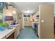 The kitchen features blue tile flooring, countertops, and ample storage at 1924 Summerfield Rd, Winter Park, FL 32792