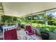 Inviting screened porch with comfortable seating and a view of the backyard at 1924 Summerfield Rd, Winter Park, FL 32792