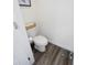 This well lit, modern bathroom features vinyl flooring and crisp white paint at 193 E Warren Ave, Longwood, FL 32750