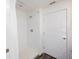 This bathroom features a bright, white tiled shower and crisp white paint at 193 E Warren Ave, Longwood, FL 32750