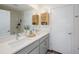 A bright bathroom featuring a double sink vanity, modern fixtures, and plenty of storage space at 193 E Warren Ave, Longwood, FL 32750