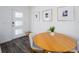 Bright dining area with a wooden table, four chairs, and contemporary decor at 193 E Warren Ave, Longwood, FL 32750