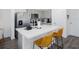 Kitchen island featuring quartz countertops and stainless steel appliances at 193 E Warren Ave, Longwood, FL 32750
