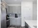 Contemporary kitchen with gray cabinets, stainless steel appliances, and plenty of storage space at 193 E Warren Ave, Longwood, FL 32750