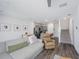 Open-concept living space featuring a modern kitchen, dining area, living room, and staircase at 193 E Warren Ave, Longwood, FL 32750