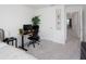 Bright home office featuring a modern desk setup, a comfortable chair, and plant decor at 193 E Warren Ave, Longwood, FL 32750