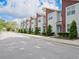 Exterior street view featuring the townhome community and Longwood water tower at 193 E Warren Ave, Longwood, FL 32750