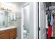 The half bathroom is adjacent to the closet and features modern fixtures and ample lighting at 1941 Sunset Palm Dr, Apopka, FL 32712