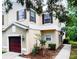Two-story home showing garage, driveway, and landscaped front yard with traditional architecture at 1941 Sunset Palm Dr, Apopka, FL 32712