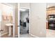 View of a half bath, garage and kitchen area, showing the layout and flow of the house at 1941 Sunset Palm Dr, Apopka, FL 32712