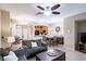 Comfortable living room with tile floors, ceiling fan, and views of the kitchen and dining area at 1941 Sunset Palm Dr, Apopka, FL 32712