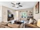 Cozy living room with ceiling fan, and large window bringing in lots of light at 1941 Sunset Palm Dr, Apopka, FL 32712