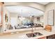 Open-concept living area showcasing a view of the dining and living room from the kitchen at 1941 Sunset Palm Dr, Apopka, FL 32712