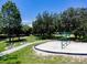 Community playground and park with benches and walking path at 1941 Sunset Palm Dr, Apopka, FL 32712