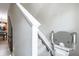 Carpeted staircase equipped with stair lift for mobility assistance at 1941 Sunset Palm Dr, Apopka, FL 32712