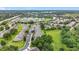 Birds eye view showcases a residential community with green spaces, street parking, and nearby highway access at 2092 Switch Grass Cir, Ocoee, FL 34761