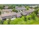 Aerial view of modern townhomes featuring outdoor patios with lush green space at 2092 Switch Grass Cir, Ocoee, FL 34761