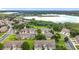 Aerial view of townhomes with lake views and manicured landscaping at 2092 Switch Grass Cir, Ocoee, FL 34761