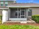 Screened back porch with privacy fence, looking out onto well-maintained yard at 2092 Switch Grass Cir, Ocoee, FL 34761