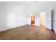Bright bedroom with hardwood floors and ample natural light, featuring a walk-in closet at 2092 Switch Grass Cir, Ocoee, FL 34761