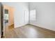 Bedroom showcasing neutral walls, wood-look flooring, and a small window at 2092 Switch Grass Cir, Ocoee, FL 34761