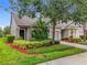 Charming home exterior features lush landscaping and a well-manicured lawn at 2092 Switch Grass Cir, Ocoee, FL 34761