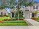 Charming townhome features a well-manicured lawn and an attached one-car garage at 2092 Switch Grass Cir, Ocoee, FL 34761
