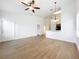 Bright living room with an open floor plan, modern lighting, and access to other rooms at 2092 Switch Grass Cir, Ocoee, FL 34761